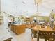 Open concept kitchen with a center island and adjacent dining area, perfect for entertaining at 3690 Wellington Pl, Bartow, FL 33830