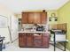 Traditional kitchen with mosaic backsplash and dark wood cabinetry at 3690 Wellington Pl, Bartow, FL 33830