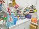 Bright laundry room with white appliances and ample shelving space for efficient organization at 3690 Wellington Pl, Bartow, FL 33830