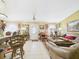 Inviting living room with tile floors, a cozy leather sofa, and classic decor elements at 3690 Wellington Pl, Bartow, FL 33830