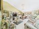 Cozy living room featuring tile flooring, a media center, and a fireplace at 3690 Wellington Pl, Bartow, FL 33830