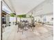 Large covered patio is perfect for outdoor dining and entertaining guests at 3690 Wellington Pl, Bartow, FL 33830