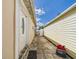 A view of the sideyard between the house and a shed at 3690 Wellington Pl, Bartow, FL 33830