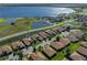 The aerial view showcases the community, the home's location, and proximity to the lake at 4115 Muirfield Loop, Lake Wales, FL 33859