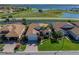 Desirable neighborhood featuring lake views, mature trees, and well-maintained landscaping at 4115 Muirfield Loop, Lake Wales, FL 33859
