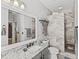 Bathroom features granite countertops, under mount sink, tiled shower and neutral paint at 4115 Muirfield Loop, Lake Wales, FL 33859