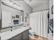 Bathroom featuring hardwood floors, a shower, a vanity sink, and white colored walls at 4115 Muirfield Loop, Lake Wales, FL 33859