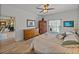 Bright bedroom with hardwood floors, ceiling fan and large windows with natural light at 4115 Muirfield Loop, Lake Wales, FL 33859