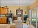 Elegant dining area with a wine cooler, stylish chairs, and adjacent outdoor patio at 4115 Muirfield Loop, Lake Wales, FL 33859
