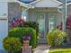 Attractive front entry with brick pathway, stone accents, and well-maintained landscaping at 4115 Muirfield Loop, Lake Wales, FL 33859