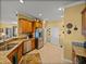 Well-lit kitchen features stainless steel appliances, ample cabinetry, and convenient access to pantry and garage at 4115 Muirfield Loop, Lake Wales, FL 33859
