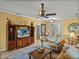 Cozy living room with a decorative media center, comfortable seating, and stylish decor at 4115 Muirfield Loop, Lake Wales, FL 33859