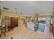 This living room includes wood floors and plenty of space to relax and enjoy the view at 4115 Muirfield Loop, Lake Wales, FL 33859