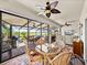 Outdoor patio with plenty of seating, a grill, and views of the pond and surrounding area at 4115 Muirfield Loop, Lake Wales, FL 33859