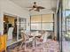 Sunroom featuring an outdoor dining area and convenient access to the home's interior at 4115 Muirfield Loop, Lake Wales, FL 33859