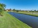Scenic waterway view, enhancing the natural beauty of the surrounding neighborhood and homes at 4115 Muirfield Loop, Lake Wales, FL 33859