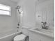 Well-lit bathroom with a tub-shower combination and a modern vanity at 412 Savanna Pointe St, Winter Haven, FL 33884