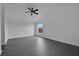 Bright bedroom featuring sleek floors, a ceiling fan, and a view to the outside at 412 Savanna Pointe St, Winter Haven, FL 33884