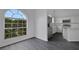 Bright eating area with a garden window, stainless steel refrigerator, and white cabinets at 412 Savanna Pointe St, Winter Haven, FL 33884