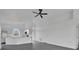 Bright open-concept living area with updated flooring and view to the modern kitchen at 412 Savanna Pointe St, Winter Haven, FL 33884