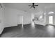 Spacious living room features modern gray floors, lots of light, and open layout at 412 Savanna Pointe St, Winter Haven, FL 33884