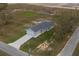 Birds-eye view of a single Gathering home with a wide driveway and well-maintained landscaping at 42 Mountain Dr, Babson Park, FL 33827