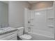 Bathroom with shower-tub, white vanity, and light gray walls at 42 Mountain Dr, Babson Park, FL 33827