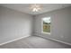 Bright bedroom with a ceiling fan and single window at 42 Mountain Dr, Babson Park, FL 33827