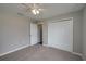 Cozy bedroom with carpeting and white closet doors at 42 Mountain Dr, Babson Park, FL 33827