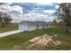 Charming single-story home featuring a two-car garage, a neutral color palette, and a well-manicured lawn at 42 Mountain Dr, Babson Park, FL 33827