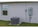 View of the exterior with an AC unit at 42 Mountain Dr, Babson Park, FL 33827