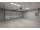Spacious garage with concrete flooring and a white garage door at 42 Mountain Dr, Babson Park, FL 33827