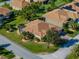Beautiful home with a screened-in lanai and lush landscaping, nestled on a corner lot at 4232 Roebelenii Dr, Lake Wales, FL 33859