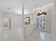 Bright foyer with tile floors, arched entryways, natural light, and traditional decor at 4232 Roebelenii Dr, Lake Wales, FL 33859