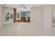 Bright living room featuring tile flooring, large windows, and an open layout at 4232 Roebelenii Dr, Lake Wales, FL 33859
