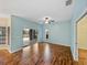 Bright living room with wood floors, sliding glass doors to patio, and ample natural light at 4232 Roebelenii Dr, Lake Wales, FL 33859