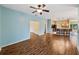 Open-concept living space showcasing wood floors, kitchen bar, and an inviting atmosphere at 4232 Roebelenii Dr, Lake Wales, FL 33859