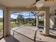 Enjoy the outdoors in this screened patio with ceiling fan and view of the landscaped backyard at 4232 Roebelenii Dr, Lake Wales, FL 33859