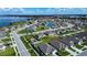 Aerial view of a residential neighborhood with a playground and pond at 447 Lanham Dr, Winter Haven, FL 33881