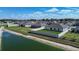 A spacious backyard with privacy fence, green space, and lakeside views at 447 Lanham Dr, Winter Haven, FL 33881