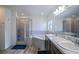 Bathroom showcases double sinks, a soaking tub, and a separate glass-enclosed shower at 447 Lanham Dr, Winter Haven, FL 33881