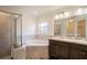 Bright bathroom featuring a soaking tub and a separate glass-enclosed shower at 447 Lanham Dr, Winter Haven, FL 33881