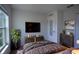 Comfortable bedroom featuring a mounted TV, a stylish dresser, and a modern design at 447 Lanham Dr, Winter Haven, FL 33881