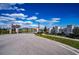 Entrance to Sanctuary at the Lake community with gated access and landscaping at 447 Lanham Dr, Winter Haven, FL 33881