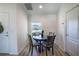 Quaint dining area featuring a round wooden table, comfortable seating, and a pleasant view at 447 Lanham Dr, Winter Haven, FL 33881