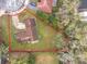 An aerial view of the outlined property showing the landscape, roofing and driveway at 4765 Lantern Ct, Orlando, FL 32808