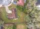 An aerial view of the property, showing off the landscape, roofing, and driveway at 4765 Lantern Ct, Orlando, FL 32808