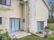 Backyard showcasing the home's siding, a patio, and a chimney at 4765 Lantern Ct, Orlando, FL 32808