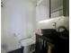 Bathroom with a vessel sink, storage cabinet, modern fixtures and toilet at 4765 Lantern Ct, Orlando, FL 32808