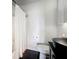 Bathroom featuring a black vessel sink, a shower with white curtain, and storage cabinet at 4765 Lantern Ct, Orlando, FL 32808